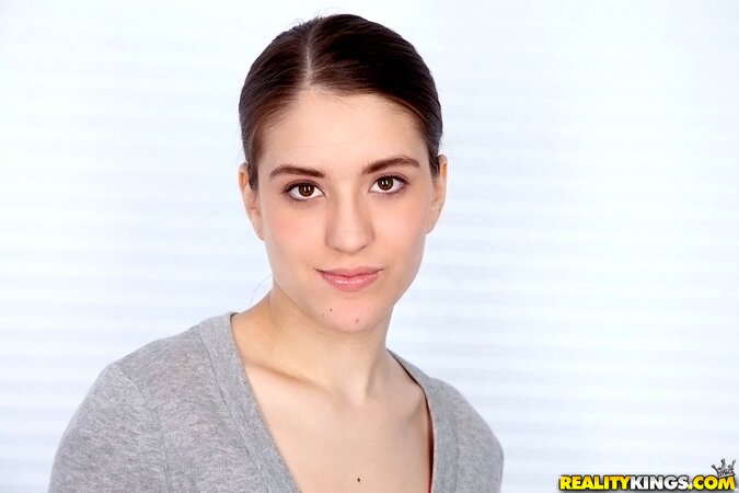 Cutie with ponytail takes off jeans and red top to impress guys with body