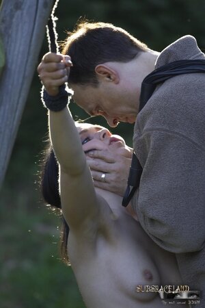 Creepy man dominates over submissive brunette outdoors in various ways