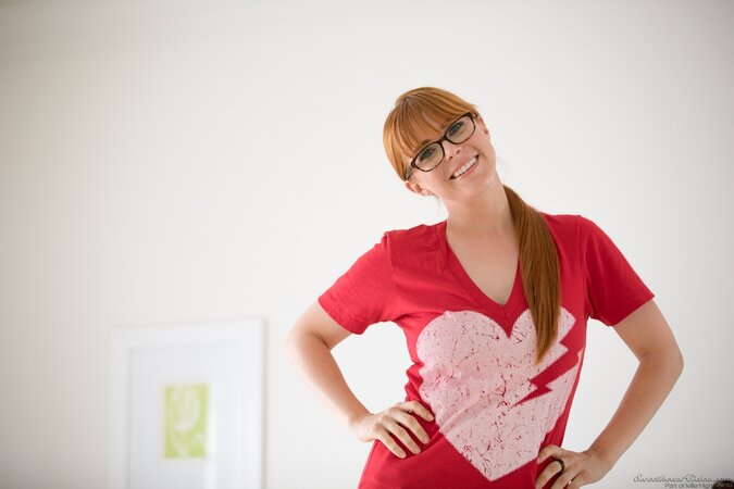 Nerdy cutie undresses to show her saggy breasts and round butt cheeks