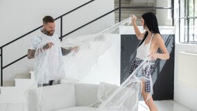 Simon Kitty opens up her legs for a tattooed man on a sofa