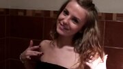 Slender amateur sucks two dicks for cash in the public toilet