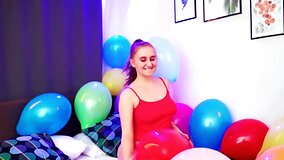 Balloon popping teaser shows her big naturals as well